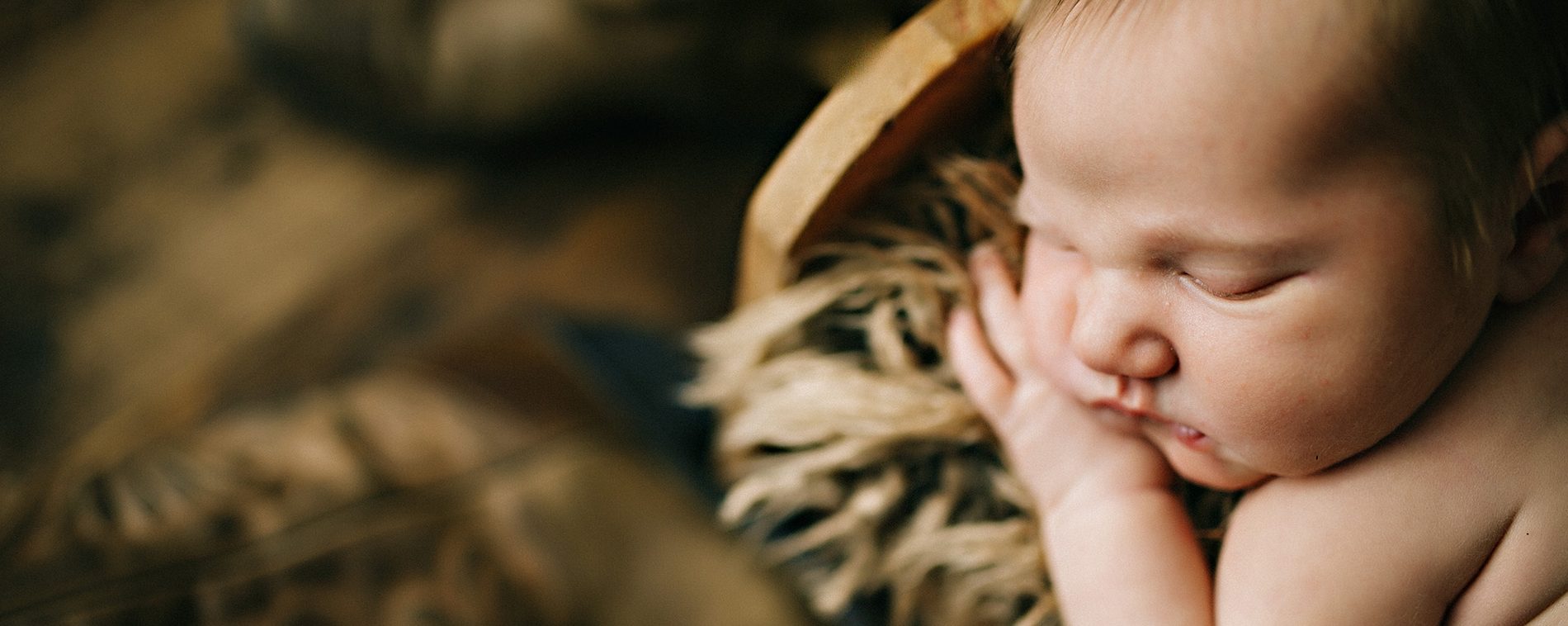 sleeping baby on fur blanket