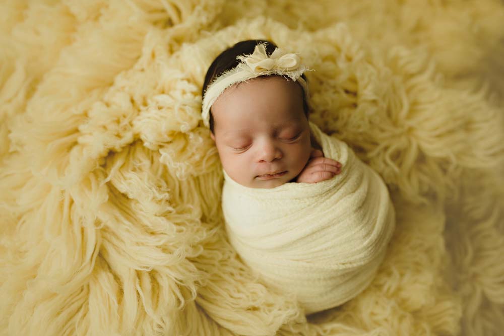 newborn in yellow
