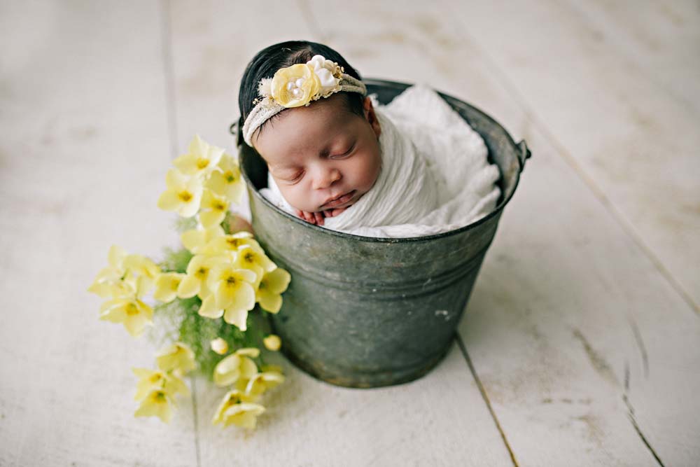 newborn in bucket
