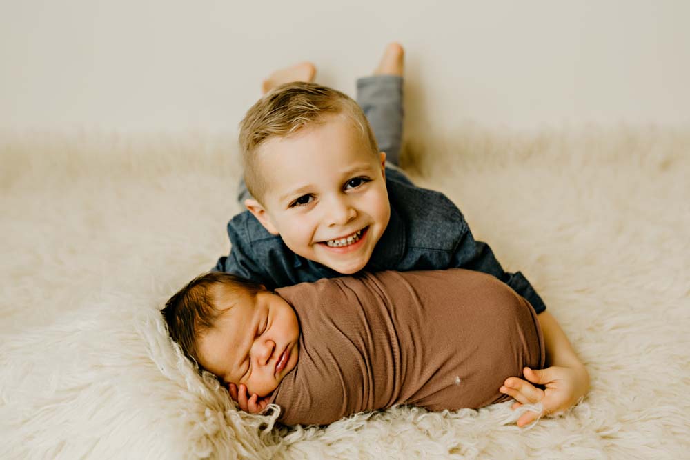 newborn in brown with boy